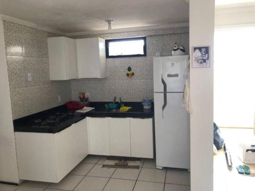 Kuchyň nebo kuchyňský kout v ubytování Condomínio Porto de Iracema