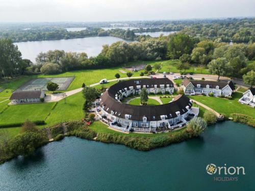 an aerial view of a large estate on a lake at Isis Lakes 09, ArtHouse in South Cerney