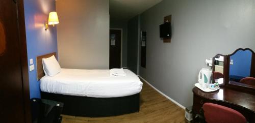 Cama o camas de una habitación en Gilson Hotel