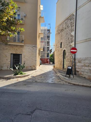 a red stop sign on the side of a street at Rossè B&B Holiday House in Trani
