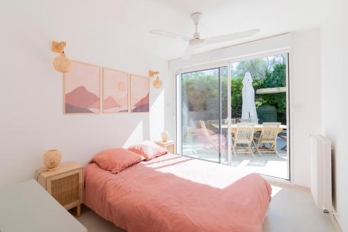 Posteľ alebo postele v izbe v ubytovaní VILLA BORD DE MER 6 COUCHAGES AVEC JARDIN ET GARAGE