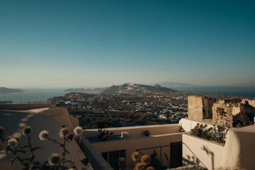 a view of a city from the side of a building at Aethra Vegan Caves in Pirgos