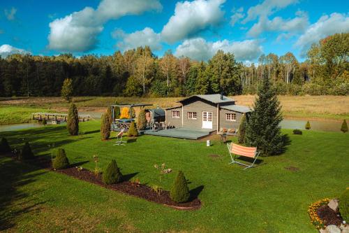 an aerial view of a house with a playground at Ciemiņos in Lieltirumi