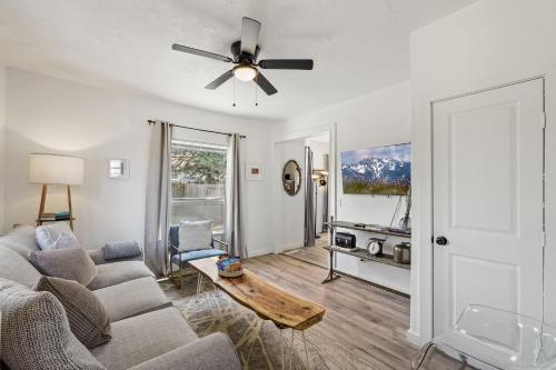 a living room with a couch and a ceiling fan at 5BR Home 6 mins OCU, Sleeps 14 #04 in Oklahoma City