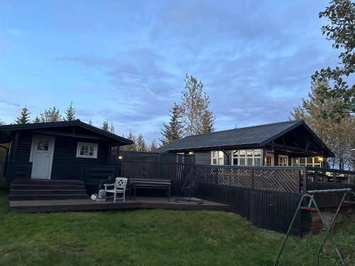 a small house with a porch and a patio at Cabin in Vaðnes in Selfoss