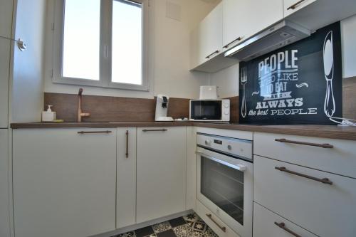 Η κουζίνα ή μικρή κουζίνα στο Appartement Proche Centre