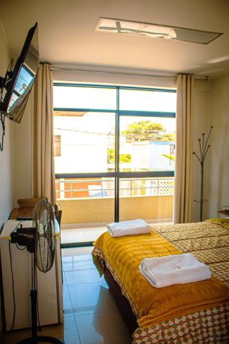 a hospital room with a bed and a window at DEL VALLE HOUSE II in Ica