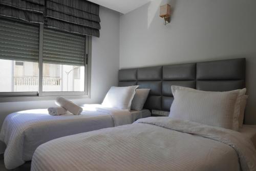 Appart Hotel Bloomにあるベッド