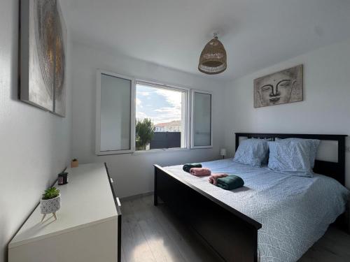 Una cama o camas en una habitación de Gîte du Chapelier