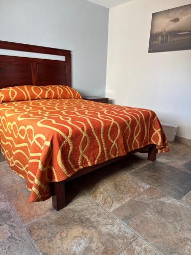 Hotel Suites Don Miguelにあるベッド