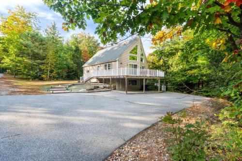 a large white house with a gambrel at Minutes to Downtown & National Forest Ash Lodge in Conway