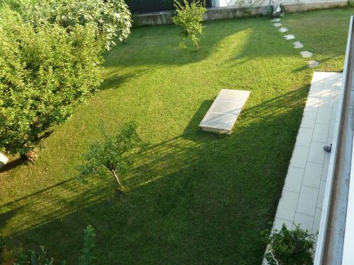 an overhead view of a backyard with a mattress on the grass at Villa Green Harmony in Bussolengo