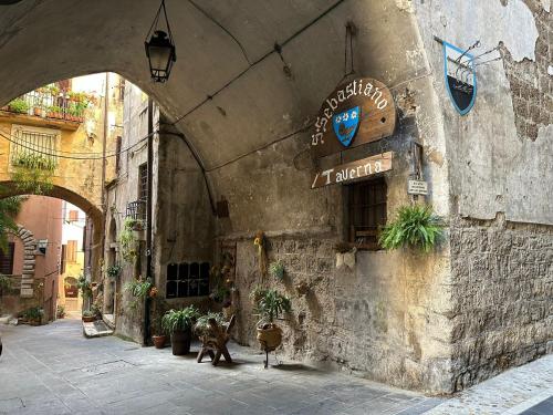 an entrance to a building with a sign on it at La Civetta - Casa vacanze Orte in Orte