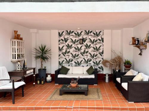 a living room with a couch and a table at Apartamentos Los Verodes in Frontera