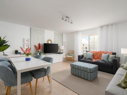 a living room with a couch and a table at Sweet Summer Apartment - Cabanas in Cabanas de Tavira