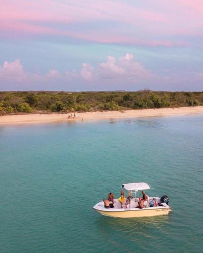 a group of people on a boat in the water at De Las Santas Camper in Cabo Rojo