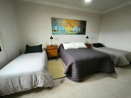 Ένα ή περισσότερα κρεβάτια σε δωμάτιο στο Habitación Cuádruple en Suite