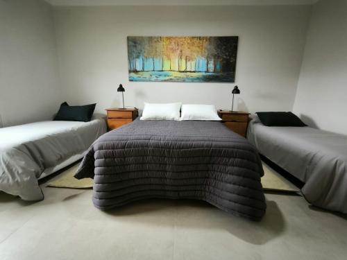 Ένα ή περισσότερα κρεβάτια σε δωμάτιο στο Habitación Cuádruple en Suite