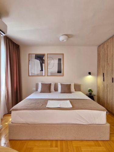 a bedroom with a large white bed in a room at Luxury Apartments Stefano - Premium in Ohrid