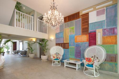 a living room filled with furniture and decorations at Sugar Bay Barbados - All Inclusive in Bridgetown
