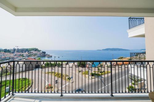 a balcony with a view of the ocean at Exclusive Hotel in Budva