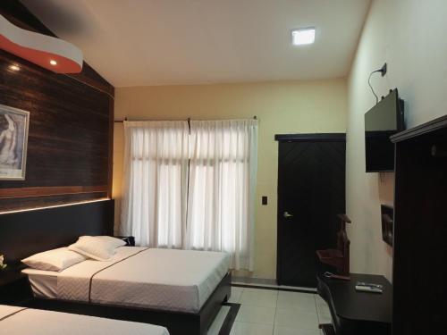 Ein Bett oder Betten in einem Zimmer der Unterkunft Terra Luna Lodge