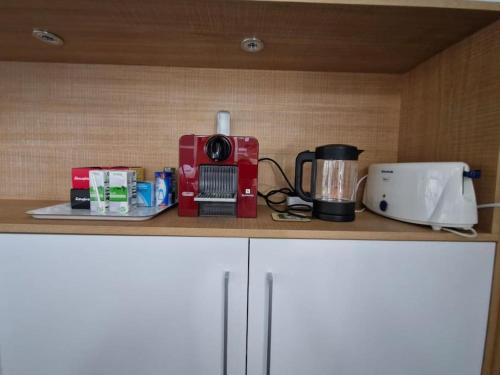 a kitchen counter with a coffee maker and a blender at Loft acogedor in Seville