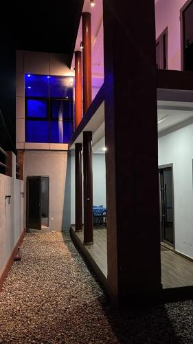 a hallway of a house with a view of a kitchen at Villa ORMACE in Lomé