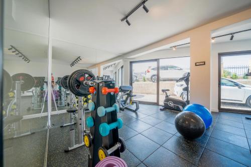 a fitness room with a gym with tread machines at Exclusive Hotel in Budva