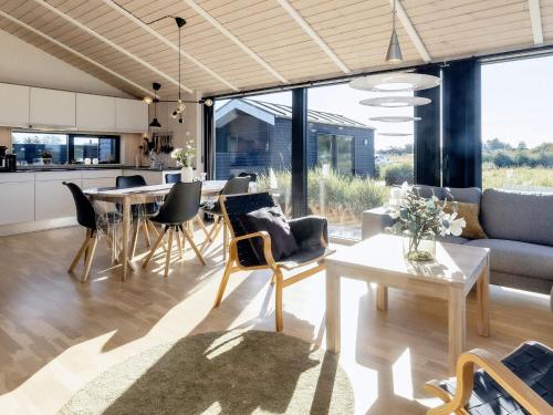 an open living room with a dining room and kitchen at 5 star holiday home in Hirtshals-By Traum in Hirtshals