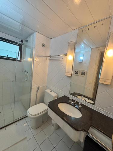 a bathroom with a toilet and a sink and a shower at Hotel Univer Pamplona Jardins ótima localização 1807 in Sao Paulo