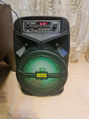 a black computer speaker sitting on a floor at Madinty amazing view 2 rooms fully air-conditioned apartment at Madinty city for families only مدينتي in Madinaty