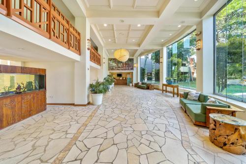 an open lobby with a large floor to ceiling windows at Kaanapali Shores 940 · KS 940 Top Floor Studio w Ocean Views AC in Lahaina