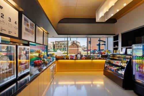 a grocery store aisle with a view of a city at aloft Hotel Milwaukee Downtown in Milwaukee