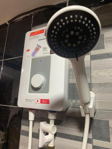 a hair dryer sitting next to a hair dryer at CuteHomes KB in Kota Belud