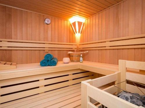 a sauna with a light on the ceiling at Holiday Home Traumzeit II in Zingst