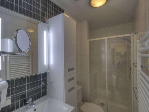 a bathroom with a shower and a sink and a toilet at Seemöwe F180 Comfortable holiday residence in Fehmarn