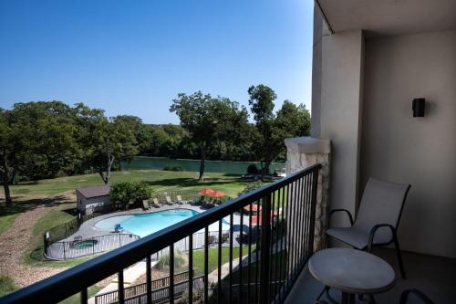 a balcony with a view of a swimming pool at Courtyard by Marriott New Braunfels River Village in New Braunfels