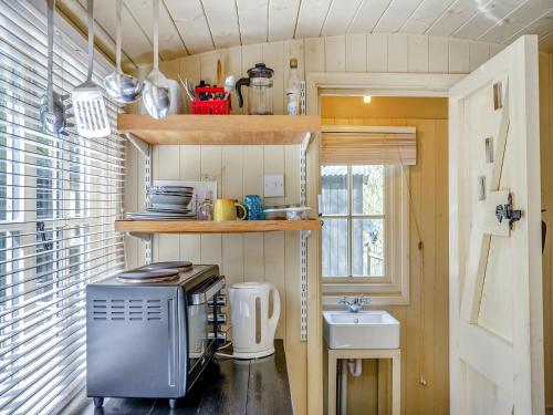 a small kitchen in a tiny house with a sink at Williams Hide - Uk43571 in Haltwhistle