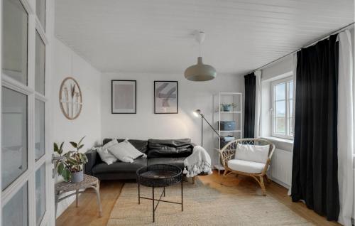 a living room with a couch and a chair at Stunning Home In Vestervig With Wifi in Vestervig