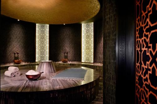 a room with a round table with towels on it at JW Marriott Marquis Hotel Dubai in Dubai