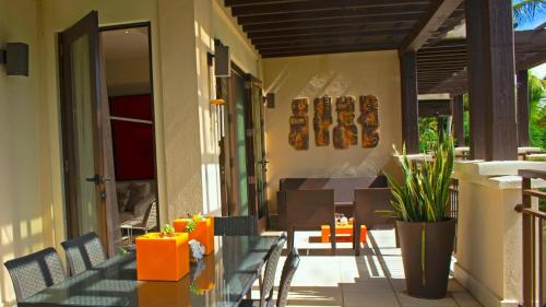 a patio with a table and chairs on a porch at Villa in Red in Rio Grande