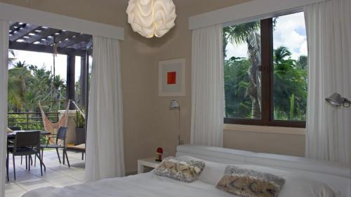 a bedroom with a bed and a view of a patio at Villa in Red in Rio Grande
