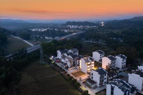 an aerial view of a city at night at 婺源县那湾那月民宿婺女洲店 in Xikeng