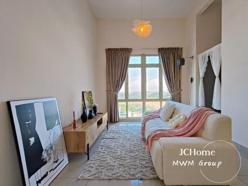 a living room with a bed and a large window at Manhattan Austin By JC Home in Johor Bahru