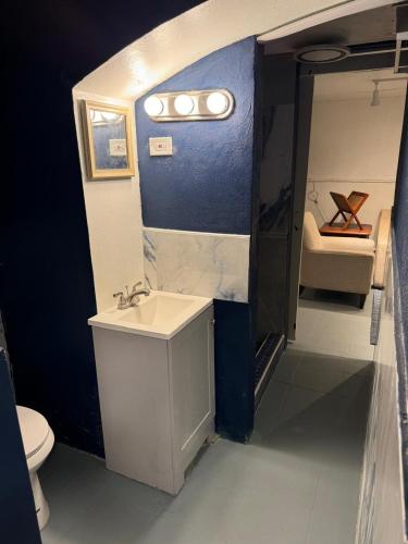 a small bathroom with a sink and a toilet at The Landmark St Thomas in Fort Christian