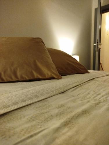 a close up of a bed with a pillow at La Chioma di Berenice in Celano