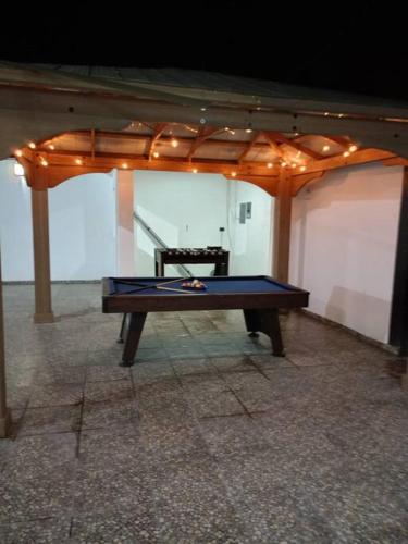 a ping pong table in the middle of a room at Las lomas in Ursulo Galván