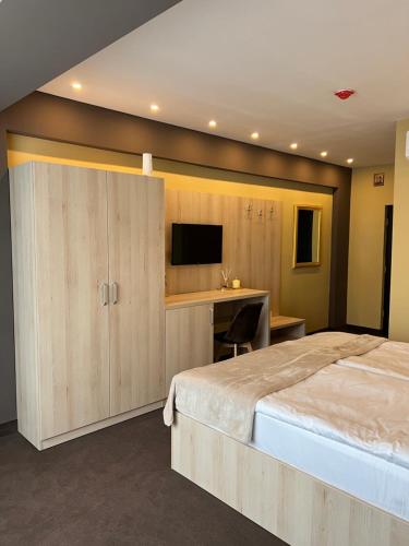 Postel nebo postele na pokoji v ubytování Hotel DAMAD