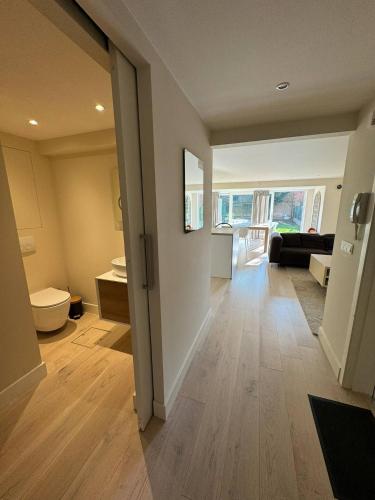 a hallway of a house with a living room at Modern Flat With Garden in Ostend